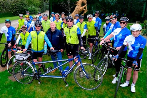 Charity bike ride cyclists gathering on the lawn