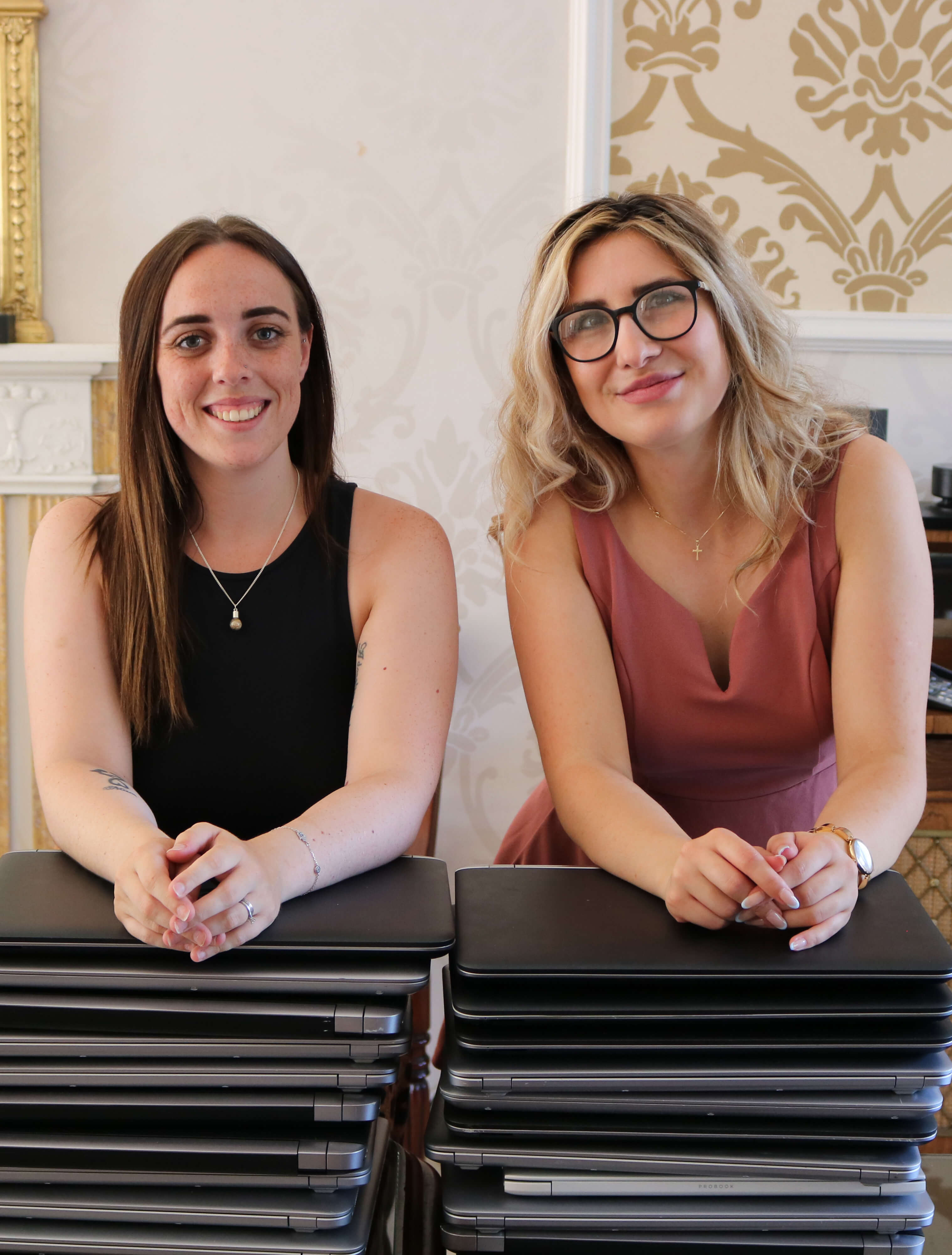 Lilley and Alexandra donating laptops