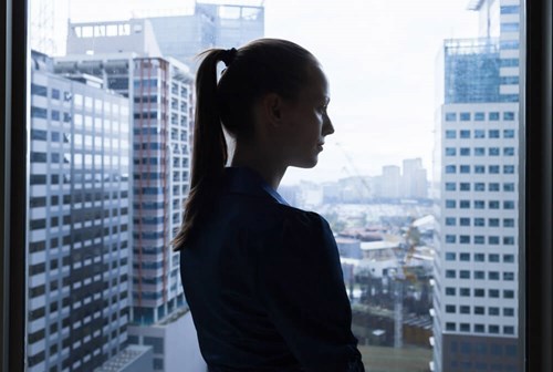 Women looking out of her office window
