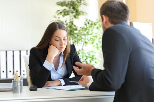 woman looking disinterested in conversation