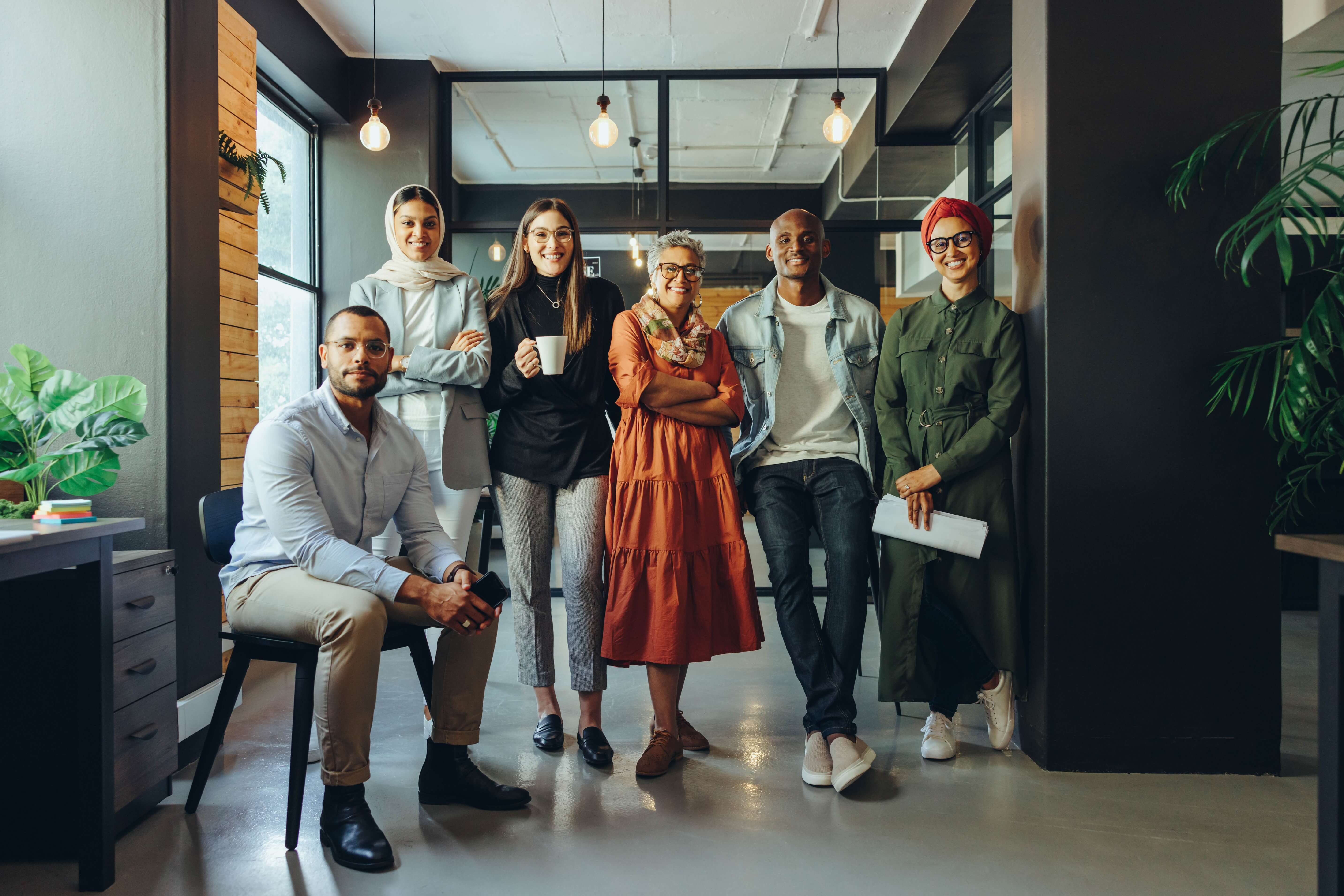 Group of employees stood in an office