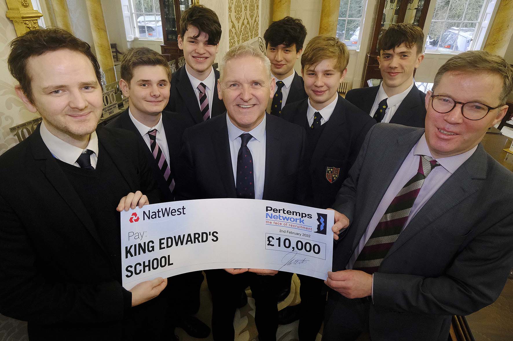 School students holding a £10000 check from Pertemps